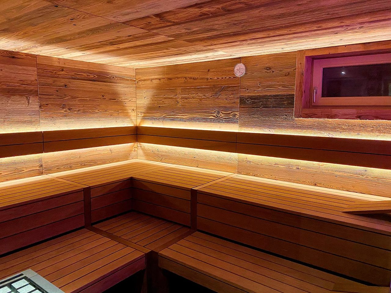 Custom-made old wood sauna in the basement with indirect LED lighting