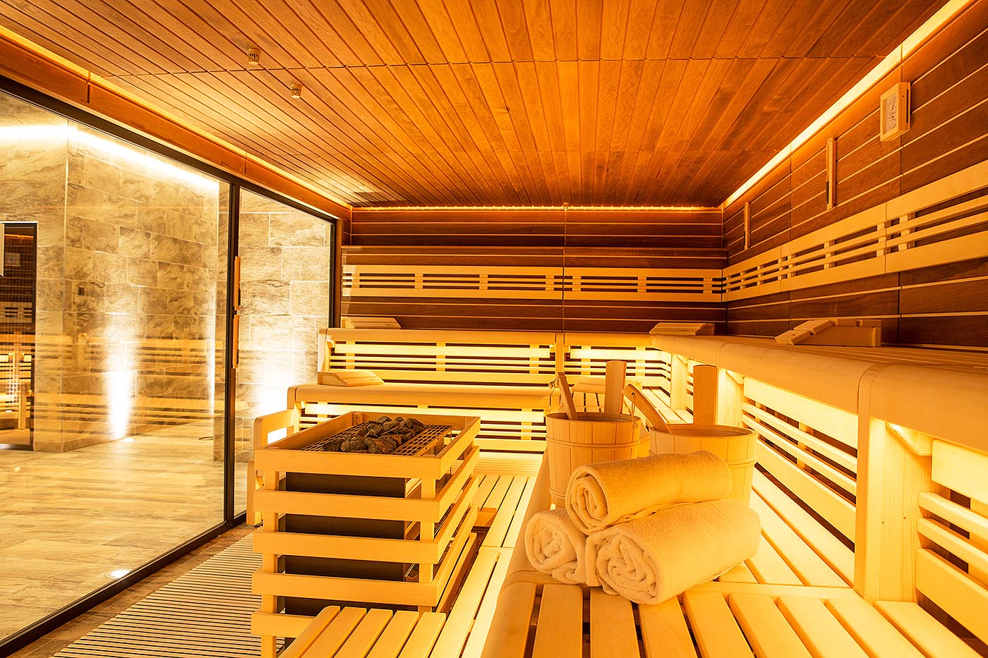 Commercial sauna with large glass front in the gym or Day SPA. made by corso sauna manufaktur