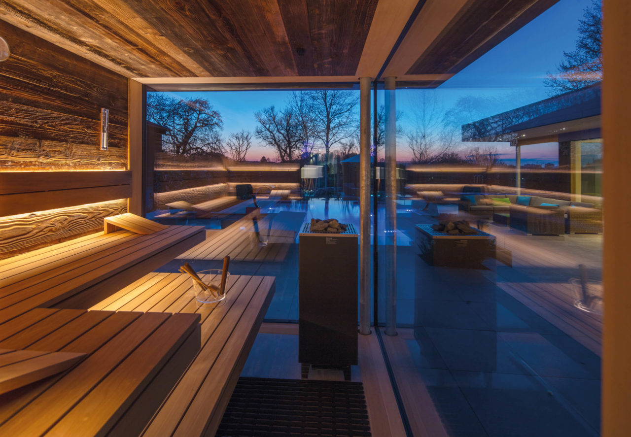 Outdoor sauna in old wood with glass front